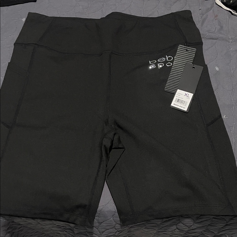 bebe Women's Black Bike Shorts pockets on the side